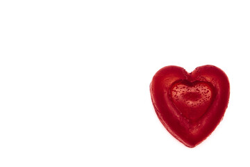 Handmade heart made from soap on a white background