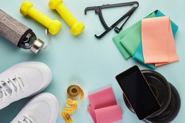 Creative flat lay of sport and fitness equipments.