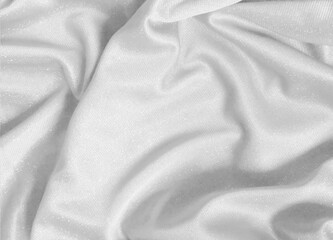 Fototapeta premium Shiny white crumpled fabric. Elegant cloth texture background