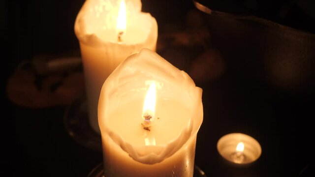 Mystical wax candles on the sorcerer's table