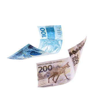 200 and 100 reais bills falling, isolated white background, brazilian money, brazilian economy