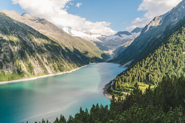 Beautiful view of Lake Schlegeis in the Austrian Alps during the summer, touristic vacation destination in Europe