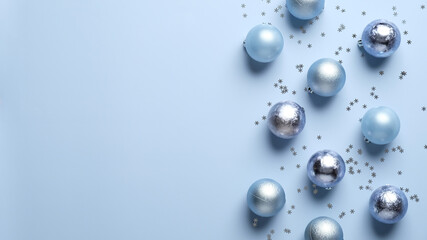 Blue Christmas background with balls decoration and silver confetti. Christmas frame border, greeting card template, banner mockup.