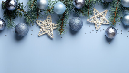 Christmas banner mockup. Christmas tree branches decorated blue and silver color balls, stars,...