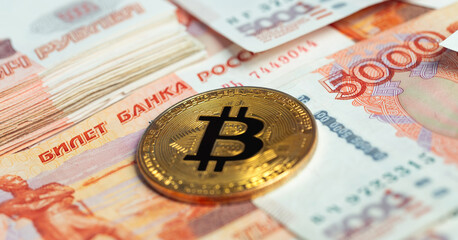 bitcoin cryptocurrency with russian rubles money, five thousand banknotes closeup