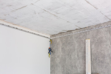 Installation of stretch ceiling. Niche for stretch ceiling. Stretch ceiling, work.