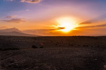 Fototapeta na wymiar Volcanic desert sunset at the hills of Jandia