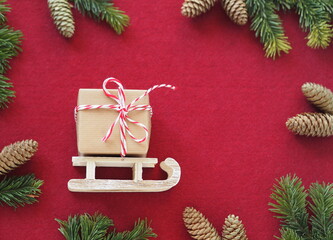 View from above. Blank for greeting cards, congratulations, banner. Greeting felt background with a gift box on a wooden sled.Place for text.