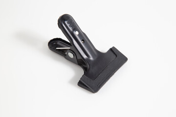 Clothespins are black on a white background.A tool for photos.