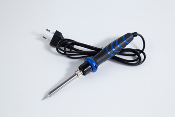 Soldering iron for electronic boards. A tool for repairing electronic components.