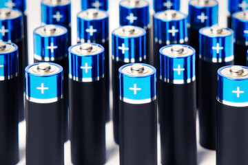 A closeup of a lot of black battery or rechargeable battery
