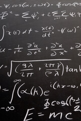 Complicated math wave equations on a blackboard