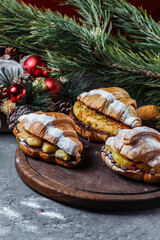 New Year's breakfast with croissants. set of three New Year's croissants. New Year's croissants with caramelized banana, orange and pineapple