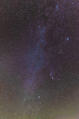 A beautiful starry night in the mountains on top with beautiful scenery and fog.