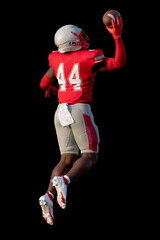 Football players displaying amazing athletic ability while making plays during a game
