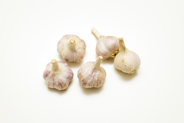 Top view of ripe whole garlic on white background
