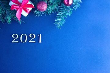 new year background 2021 dark with gift with red ribbon and fir branches