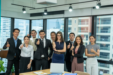 Portrait of creative business team standing together in the office,Multiracial business people together at startup.