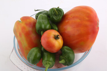 tomatoes and small spicy green peppers as vegan ingredients