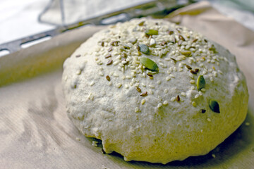 Yeast-free bread dough formed into baking loaves on a baking sheet. The process of making natural homemade sourdough bread with your own hands.Self-made bread at home