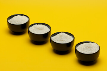 Сoconut shavings on a yellow background