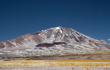 Volcanic landscape in the Andes mountain range. View of Volcano Incahuasi in a summer day in Catamarca, Argentina.