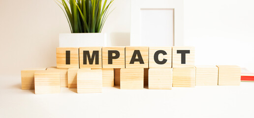 Wooden cubes with letters on a white table. White background.