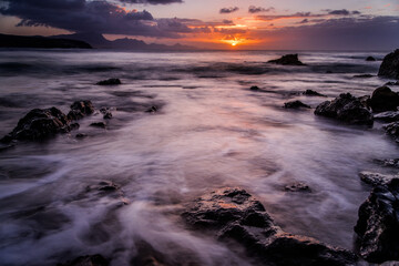 Waves and sunset at the coastline of Fuerteventura