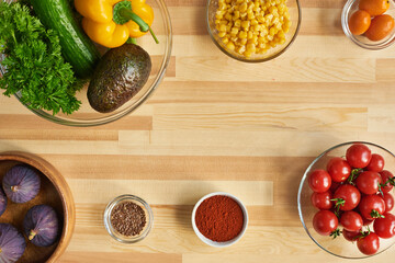 High angle view of fresh vegetables and spices for cooking on the table