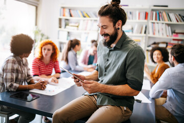 Group of business people collaborating on project in office