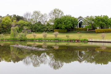 A fireworks pontoon floating on a lake in a garden