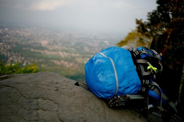close up blue backpack on the rock mountain