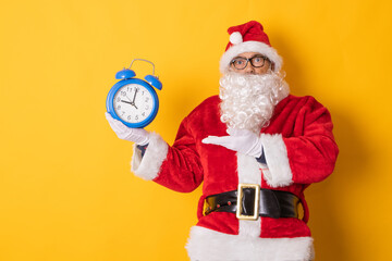 isolated santa claus with clock announcing christmas