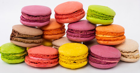 colorful macaroons on wooden background
