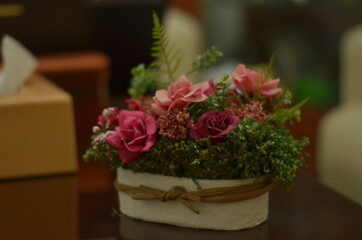 Boquet Of White Tulips, Pink Roses And Blue Hortensia Flowers on black glass table