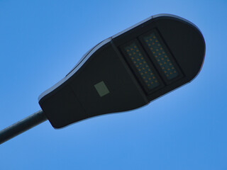 A street LED lamp on the sky blue background - 388614912