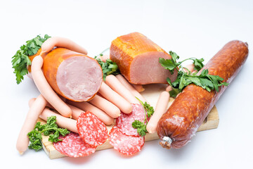 Meat and sausages. Isolated on white.