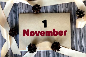 November 1 on craft paper on a wooden background.Autumn .Calendar for November.