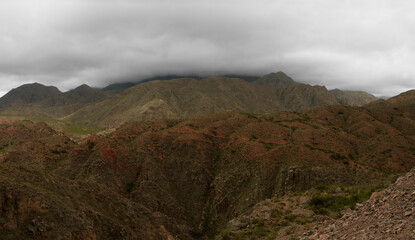 High in the Andes mountains. Beautiful view of the red and green hills in the popular landmark Miranda Slope in La Rioja, Argentina.