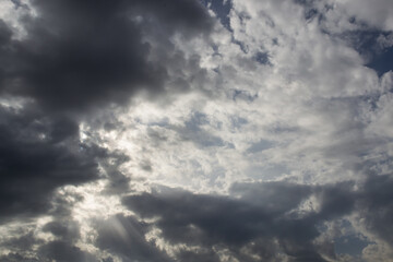 blue sky with white and rainy clouds on a sunny autumn day