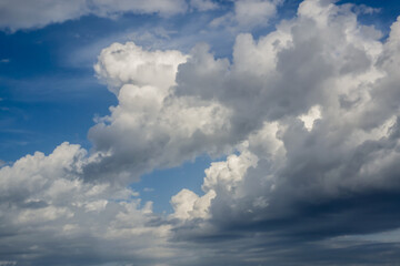 blue sky with white and rainy clouds on a sunny autumn day