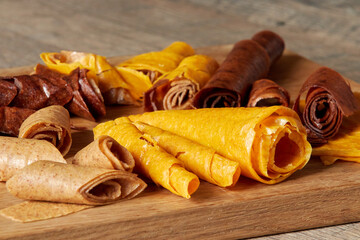 Fruit pastille. Natural sweets from berries and fruits. Useful sweets are pastilles, fruit chips. Dietary vitamin nutrition. Vegan food.