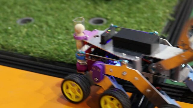 Homemade robot on wheels with eyes. Hobby robotics.