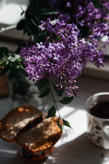 Obraz na płótnie Canvas still life with lilac flowers and tea