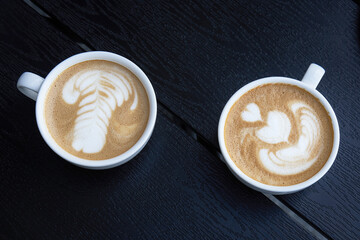 Cup of coffee with milk opposing points of view during coffee break