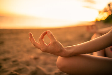 hands on the beach meditating 