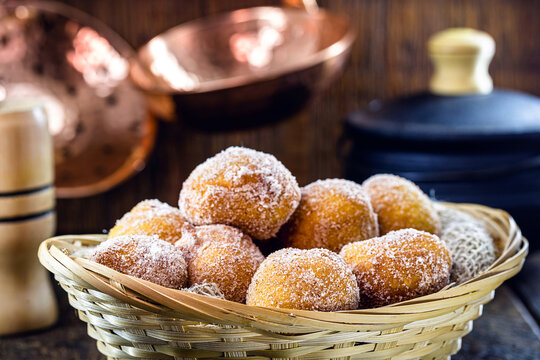 Homemade fried and sweet ricotta dumplings with powdered sugar, known as fritule or rain dumpling