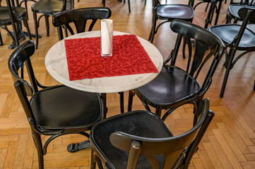 Antique chairs around a table in a restaurant