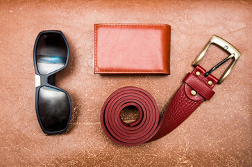 stylish modern Sunglasses and red leather belt, brown wallet - objects - fashion accessories for man