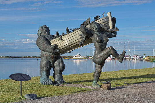 Kuressaare, Saaremaa island, Estonia. Toell the Great and his wife Piret got good catch - sculptural composition of the characters of Estonian folk mythology.